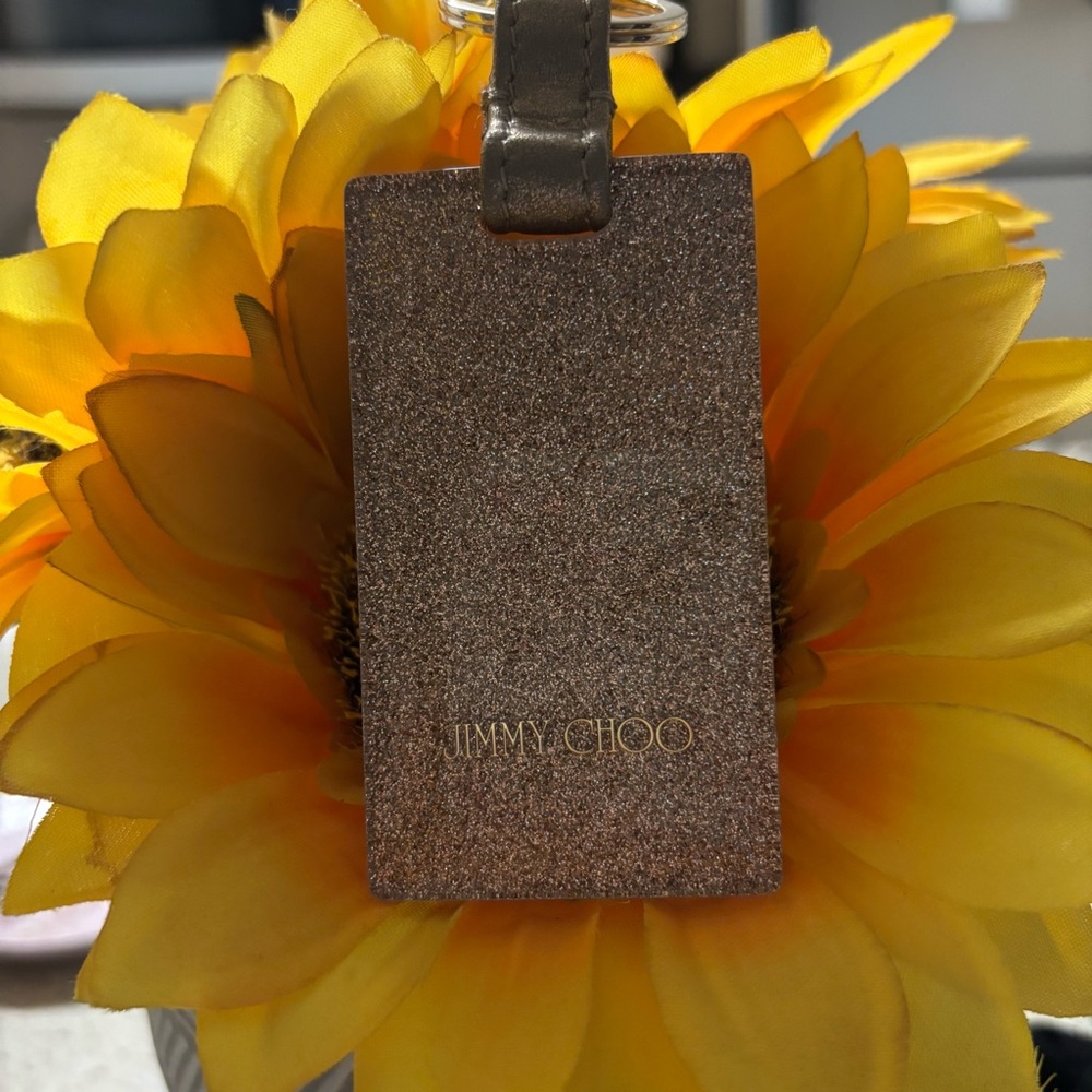 Brand New Jimmy CHOO Keychain GOLD Sparkles on one side and BLACK on the other.